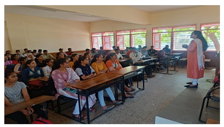 Miss. Rachana Gangurde, Faculty of B.B.A. addressing to B.Com. students in lecture series on the topic, how to face interview.
